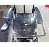A clear swing over wheelchair tray installed on a wheelchair