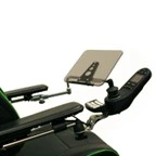 An adjustable tray installed on a wheelchair