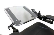 An adjustable tray installed on a wheelchair