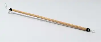 A wooden dressing aid with a long, smooth, light-colored wooden handle. One end has a curved hook for pulling up clothing like pants or socks, while the other end features a flat or slightly angled pusher to help guide fabric into place.