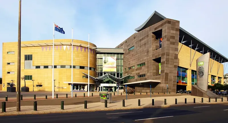 Showing Te Papa museum, a big modern building made of tiles in yellow and grey