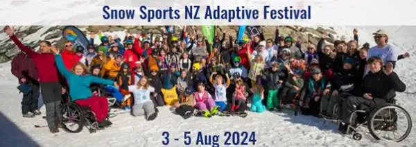 A cheerful group of people of all ages and abilities pose in the snow, bundled up in winter clothing. Some are using wheelchairs, all celebrating a joyful and inclusive snow sports festival.