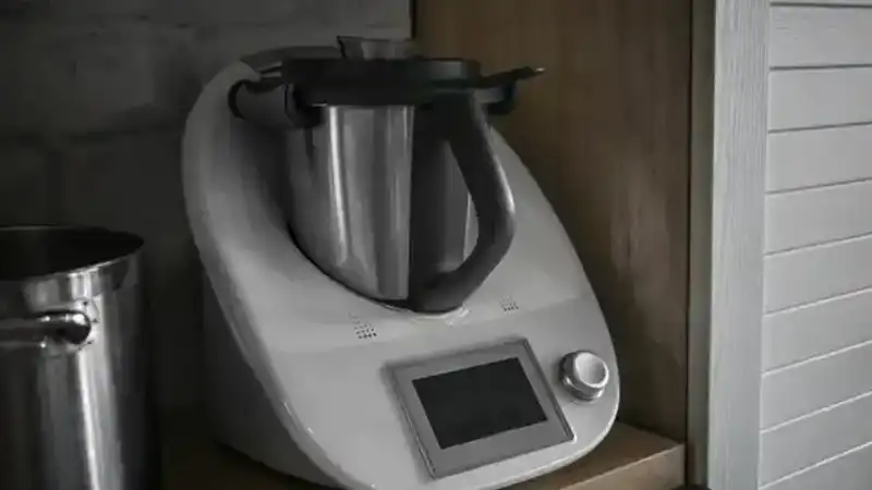 A Thermomix is a kitchen appliance that can chop, blend, mix, and more. It has a motor, heating element, and weighing scale.