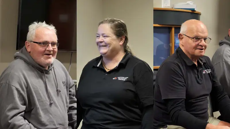 A column for each person Scott, Kate and Grant. Scott is in his late thirties, has white hair, is wearing glasses and a grey hoody. Kate is in her late forties has shoulder length brown hair and is wearing a Volunteer Central black uniform. Grant is in retirement age, has white hair, glasses and is wearing a Volunteer Central uniform.