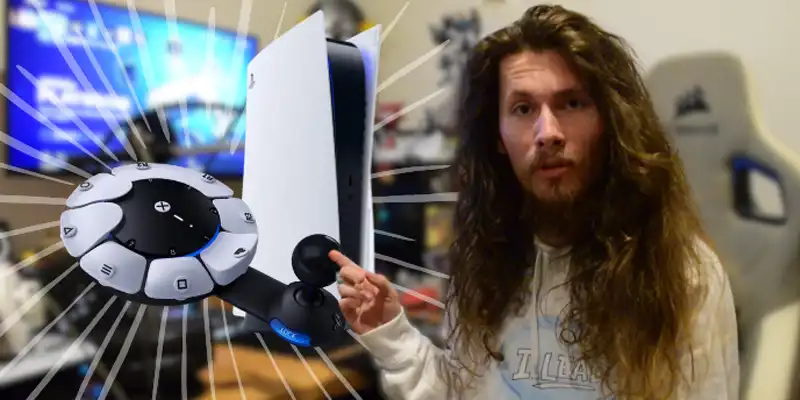 Lachlan - a European male with  long hair - sits next to his gaming pointing towards a Playstation 5 with a PS% controller