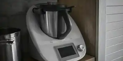 A Thermomix is a kitchen appliance that can chop, blend, mix, and more. It has a motor, heating element, and weighing scale.